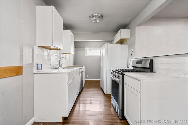6264 E Latimer St, Tulsa, OK 74115 - kitchen featuring appliances with stainless steel finishes, decorative backsplash, and light countertops