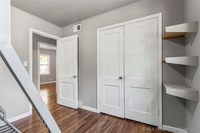 6264 E Latimer St, Tulsa, OK 74115 - unfurnished bedroom featuring wood finished floors, ornamental molding, and a closet