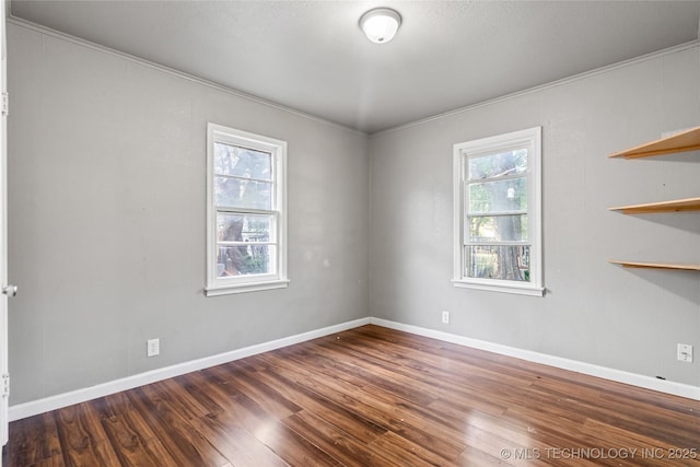 6264 E Latimer St, Tulsa, OK 74115 - unfurnished room featuring wood finished floors and crown molding