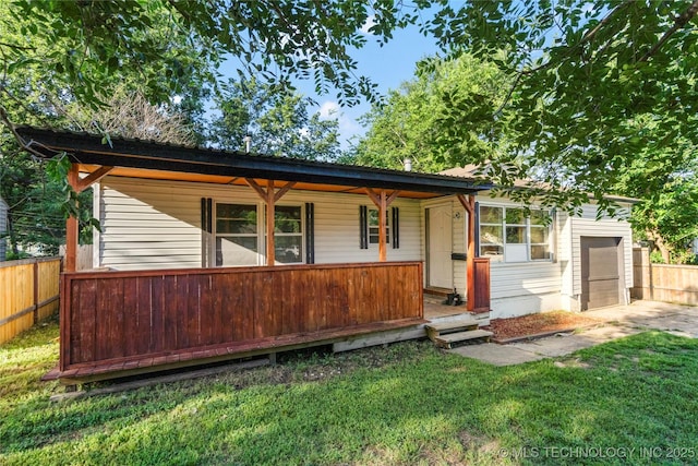 6264 E Latimer St, Tulsa, OK 74115 - ranch-style home featuring a porch and a garage