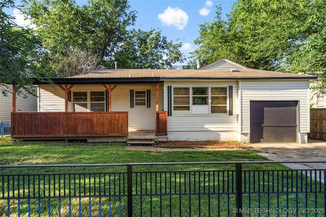 6264 E Latimer St, Tulsa, OK 74115 - ranch-style home featuring an attached garage, driveway, a fenced backyard, and covered porch