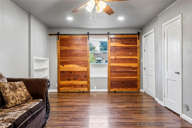 6264 E Latimer St, Tulsa, OK 74115 - living area featuring ornamental molding, ceiling fan, wood finished floors, and a barn door