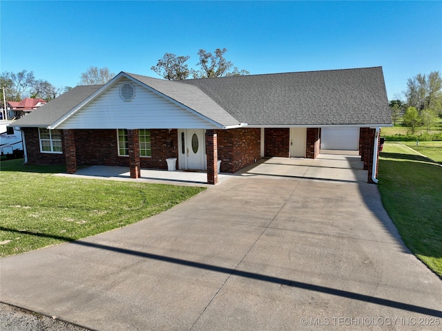 215 Belt St, Eufaula, OK 74432 - view of front of property featuring brick siding, concrete driveway, a front yard, and covered porch