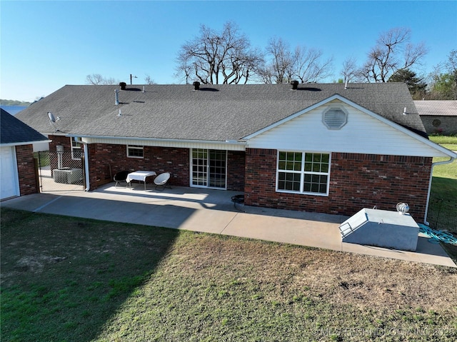 215 Belt St, Eufaula, OK 74432 - rear view of property with brick siding, roof with shingles, and a patio