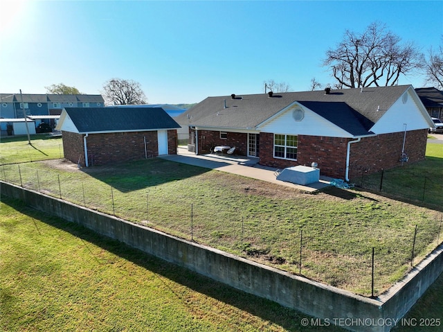 215 Belt St, Eufaula, OK 74432 - rear view of house with a patio, brick siding, a fenced backyard, and an outbuilding