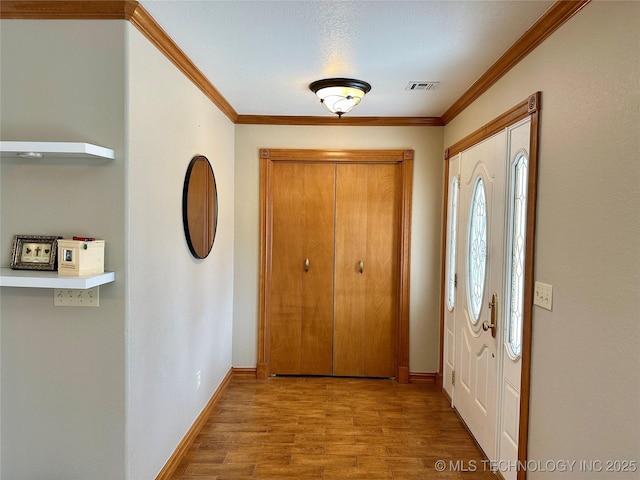 215 Belt St, Eufaula, OK 74432 - foyer entrance with crown molding and wood finished floors