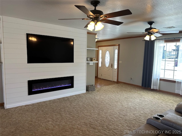 215 Belt St, Eufaula, OK 74432 - unfurnished living room featuring a fireplace, a ceiling fan, carpet flooring, a textured ceiling, and crown molding