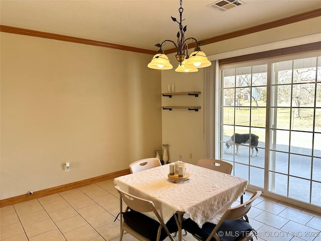 215 Belt St, Eufaula, OK 74432 - dining space with light tile patterned flooring, a chandelier, and crown molding