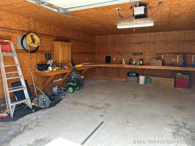 215 Belt St, Eufaula, OK 74432 - garage featuring a garage door opener and a workshop area