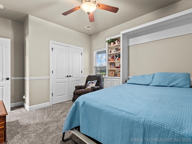 5719 Nottingham Pl, Bartlesville, OK 74006 - bedroom featuring carpet, ceiling fan, and a closet