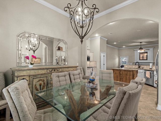 5719 Nottingham Pl, Bartlesville, OK 74006 - dining space featuring arched walkways, a chandelier, crown molding, and recessed lighting