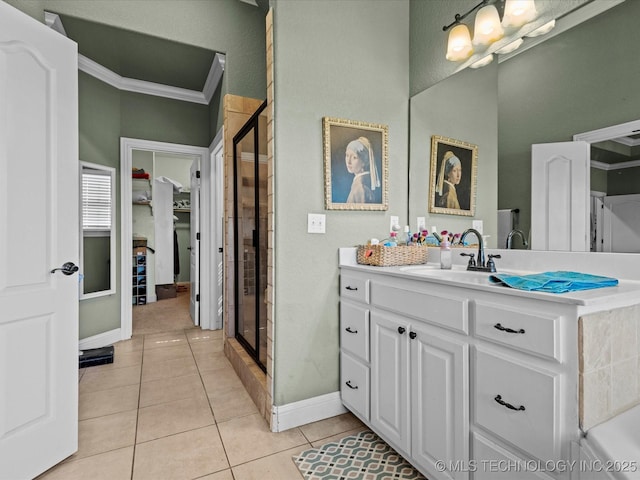 5719 Nottingham Pl, Bartlesville, OK 74006 - full bathroom with a stall shower, vanity, tile patterned flooring, crown molding, and a bathtub