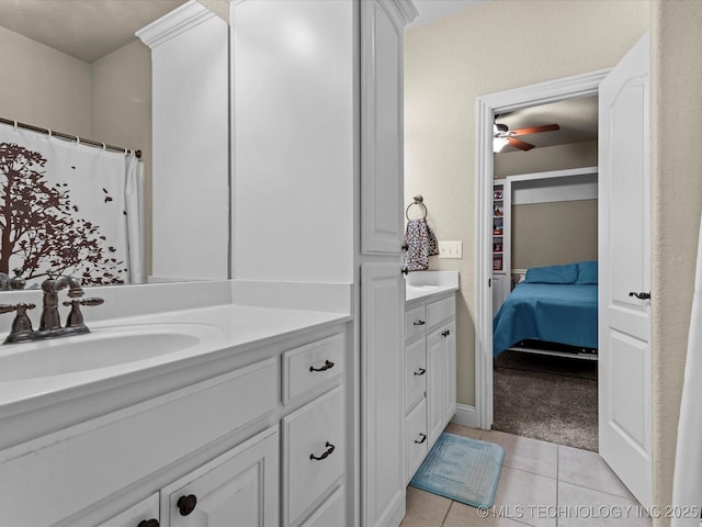 5719 Nottingham Pl, Bartlesville, OK 74006 - ensuite bathroom with vanity, tile patterned flooring, and a ceiling fan