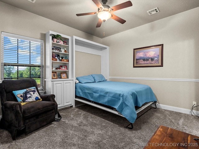 5719 Nottingham Pl, Bartlesville, OK 74006 - bedroom with carpet floors and ceiling fan
