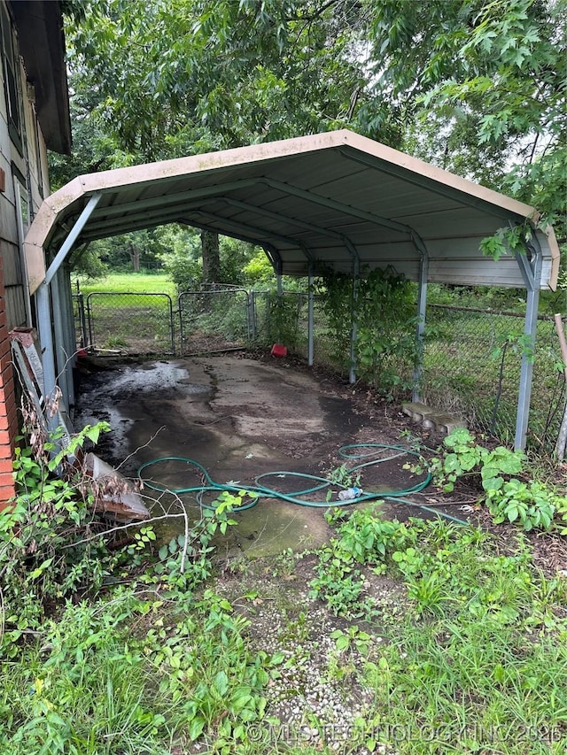 4950 E 41st St N, Tulsa, OK 74115 - view of vehicle parking with a carport