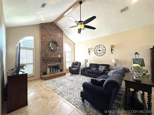 1530 Persimmon, Ardmore, OK 73401 - living room featuring healthy amount of natural light, a ceiling fan, light tile patterned floors, beamed ceiling, and high vaulted ceiling
