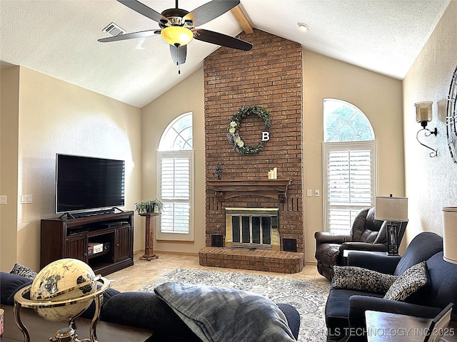 1530 Persimmon, Ardmore, OK 73401 - living room with ceiling fan, high vaulted ceiling, light tile patterned floors, a fireplace, and beam ceiling