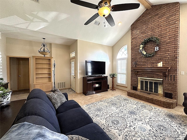 1530 Persimmon, Ardmore, OK 73401 - living area featuring ceiling fan, beam ceiling, light tile patterned floors, high vaulted ceiling, and a brick fireplace