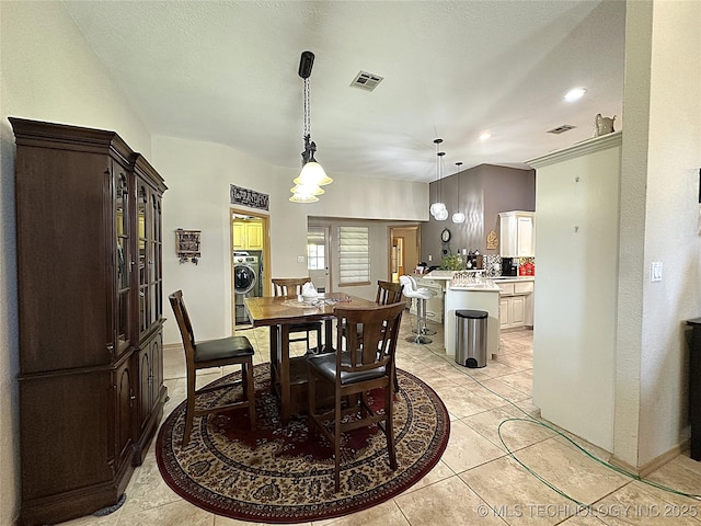 1530 Persimmon, Ardmore, OK 73401 - dining area featuring washer / clothes dryer, light tile patterned flooring, and recessed lighting
