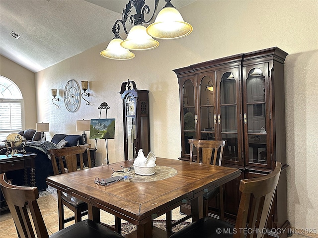 1530 Persimmon, Ardmore, OK 73401 - dining room featuring lofted ceiling and a textured wall