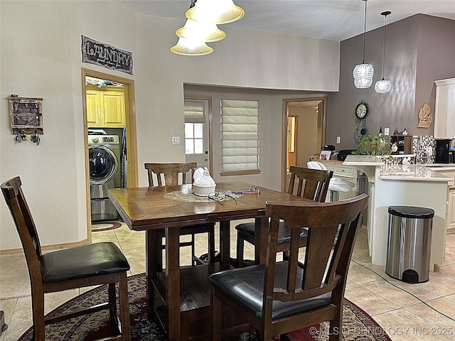 1530 Persimmon, Ardmore, OK 73401 - dining room featuring washer / dryer and light tile patterned floors