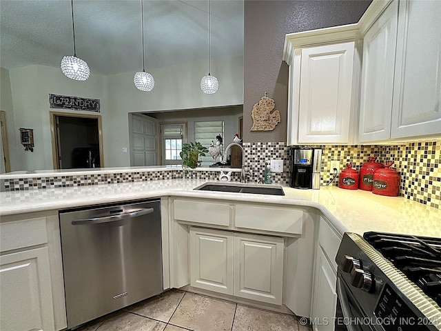 1530 Persimmon, Ardmore, OK 73401 - kitchen with stainless steel dishwasher, black gas range oven, backsplash, and light countertops