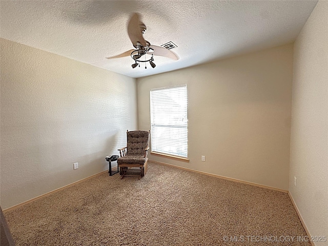 1530 Persimmon, Ardmore, OK 73401 - sitting room with a ceiling fan, carpet, and a textured ceiling