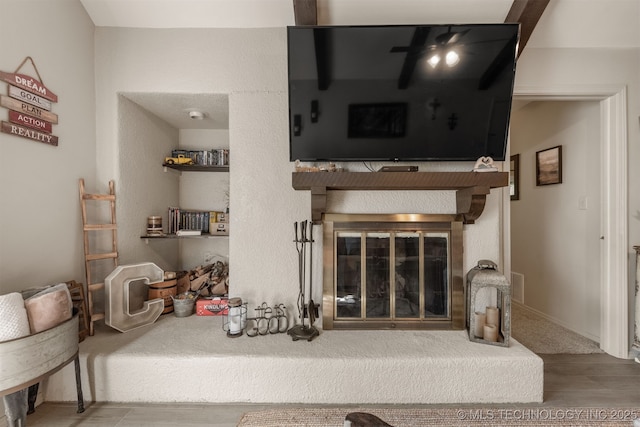 15917 E 131st St Unit 93, Broken Arrow, OK 74011 - living room with a glass covered fireplace and wood finished floors