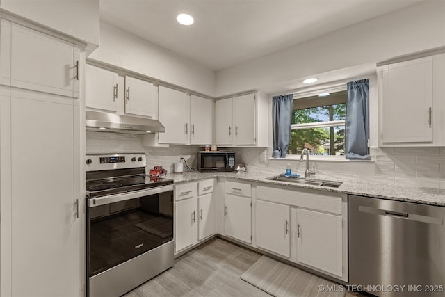 15917 E 131st St Unit 93, Broken Arrow, OK 74011 - kitchen featuring stainless steel appliances, under cabinet range hood, white cabinets, decorative backsplash, and recessed lighting