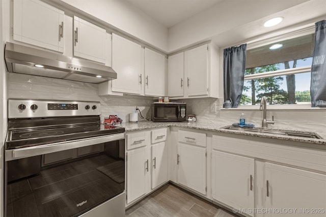 15917 E 131st St Unit 93, Broken Arrow, OK 74011 - kitchen featuring stainless steel range with electric stovetop, under cabinet range hood, black microwave, white cabinets, and decorative backsplash