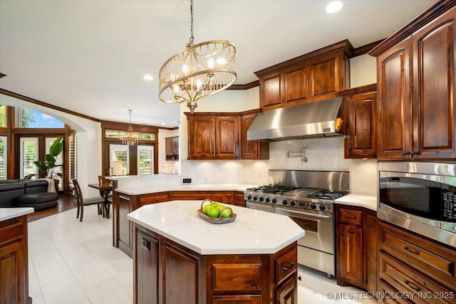 6797 Hummingbird Ct, Owasso, OK 74055 - kitchen with extractor fan, appliances with stainless steel finishes, light countertops, a chandelier, and recessed lighting