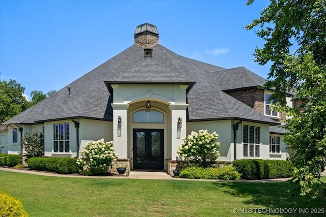 6797 Hummingbird Ct, Owasso, OK 74055 - view of front of property with french doors, a front yard, stucco siding, and roof with shingles