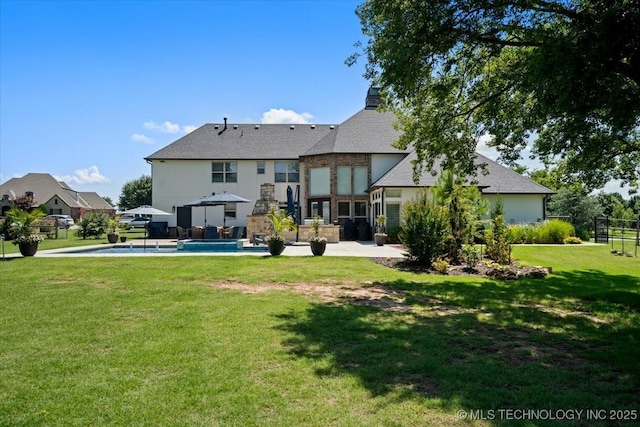 6797 Hummingbird Ct, Owasso, OK 74055 - rear view of property featuring a patio, an outdoor pool, and a yard
