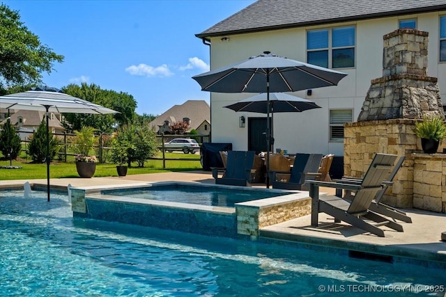 6797 Hummingbird Ct, Owasso, OK 74055 - view of swimming pool with a pool with connected hot tub and a patio