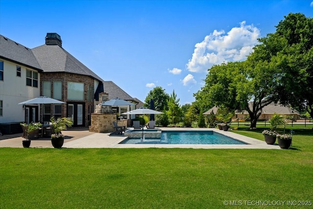 6797 Hummingbird Ct, Owasso, OK 74055 - view of pool with a patio, a yard, and a pool with connected hot tub