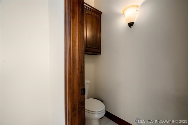 6797 Hummingbird Ct, Owasso, OK 74055 - bathroom featuring toilet and tile patterned floors