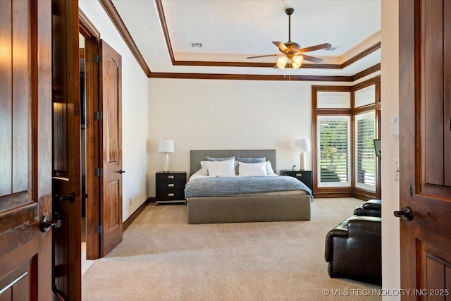 6797 Hummingbird Ct, Owasso, OK 74055 - bedroom featuring ornamental molding, light carpet, a ceiling fan, and a tray ceiling