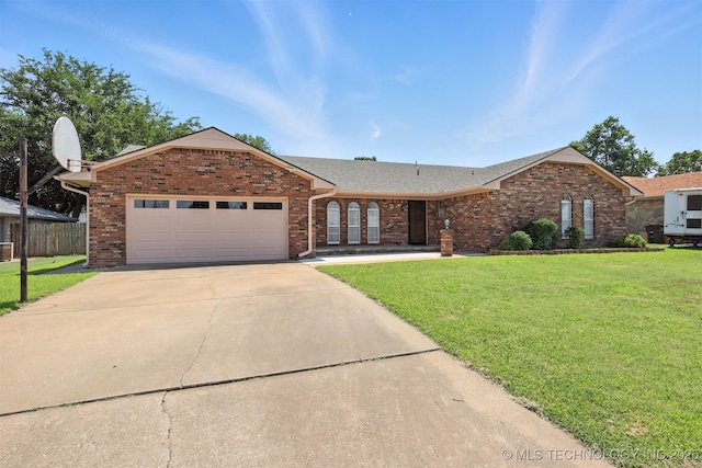 6627 Castle Ct, Bartlesville, OK 74006 - ranch-style house featuring a front yard, a garage, concrete driveway, brick siding, and roof with shingles