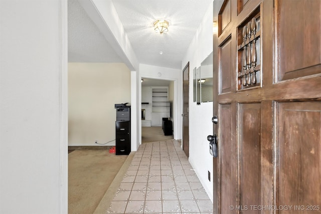 6627 Castle Ct, Bartlesville, OK 74006 - hall with light colored carpet and a textured ceiling