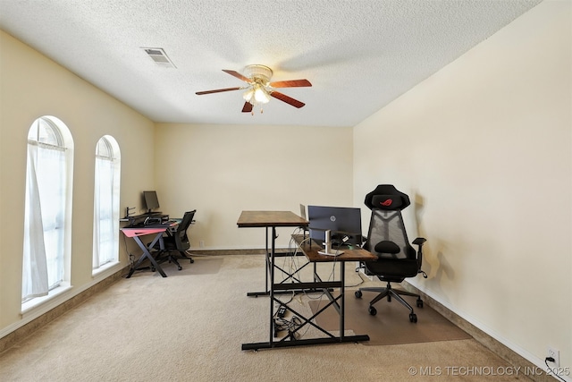 6627 Castle Ct, Bartlesville, OK 74006 - office area featuring carpet flooring, ceiling fan, and a textured ceiling