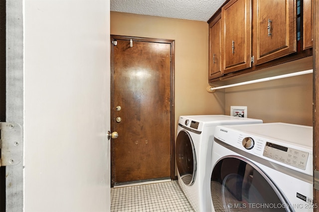 6627 Castle Ct, Bartlesville, OK 74006 - laundry room with cabinet space, independent washer and dryer, light tile patterned floors, and a textured ceiling
