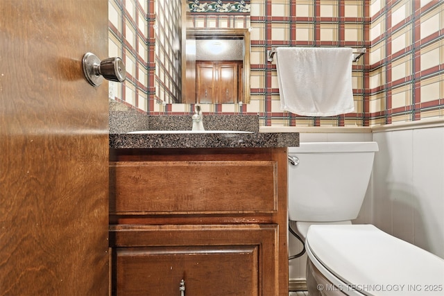 6627 Castle Ct, Bartlesville, OK 74006 - bathroom with wallpapered walls and vanity