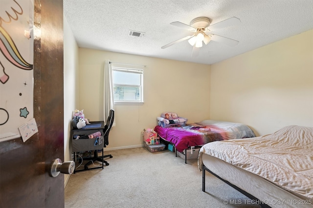 6627 Castle Ct, Bartlesville, OK 74006 - bedroom with carpet floors, a textured ceiling, and a ceiling fan