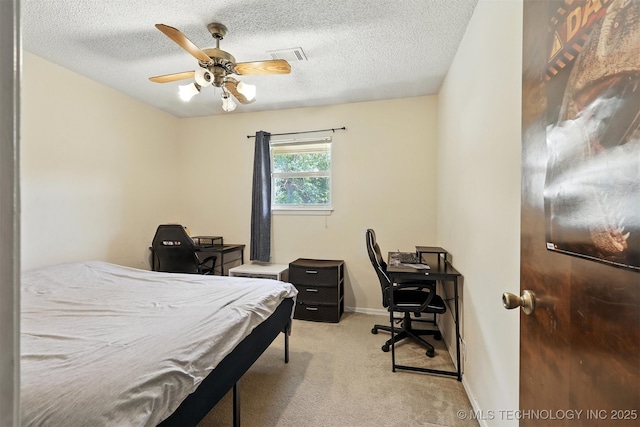 6627 Castle Ct, Bartlesville, OK 74006 - bedroom with carpet floors, a desk, a textured ceiling, and ceiling fan