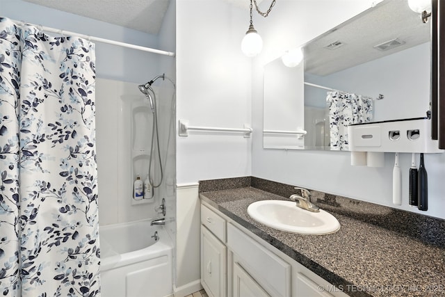 6627 Castle Ct, Bartlesville, OK 74006 - bathroom with vanity, shower / bath combo, and a textured ceiling