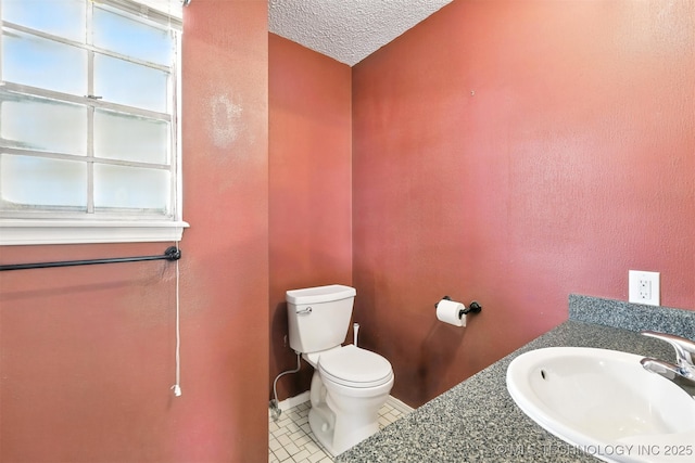 6627 Castle Ct, Bartlesville, OK 74006 - bathroom with vanity, tile patterned flooring, and a textured ceiling