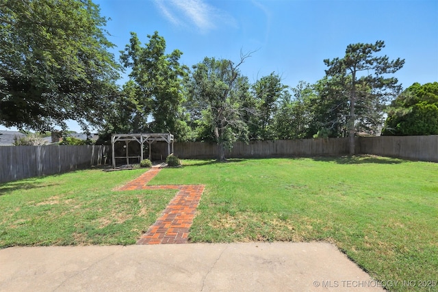6627 Castle Ct, Bartlesville, OK 74006 - fenced backyard with a pergola
