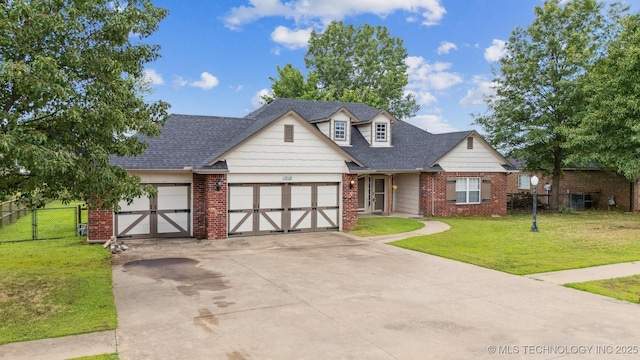 1018 W Evergreen St, Skiatook, OK 74070 - view of front of home featuring an attached garage, driveway, brick siding, roof with shingles, and a gate