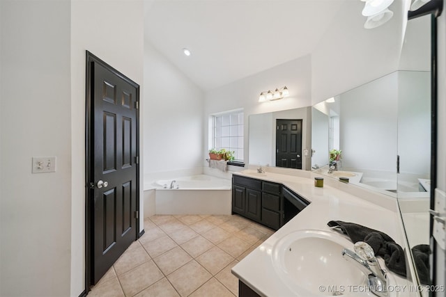 1018 W Evergreen St, Skiatook, OK 74070 - bathroom with vaulted ceiling, double vanity, tile patterned floors, a bath, and recessed lighting