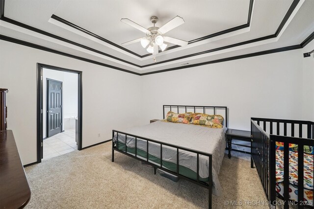 1018 W Evergreen St, Skiatook, OK 74070 - bedroom featuring a tray ceiling, crown molding, light carpet, and a ceiling fan